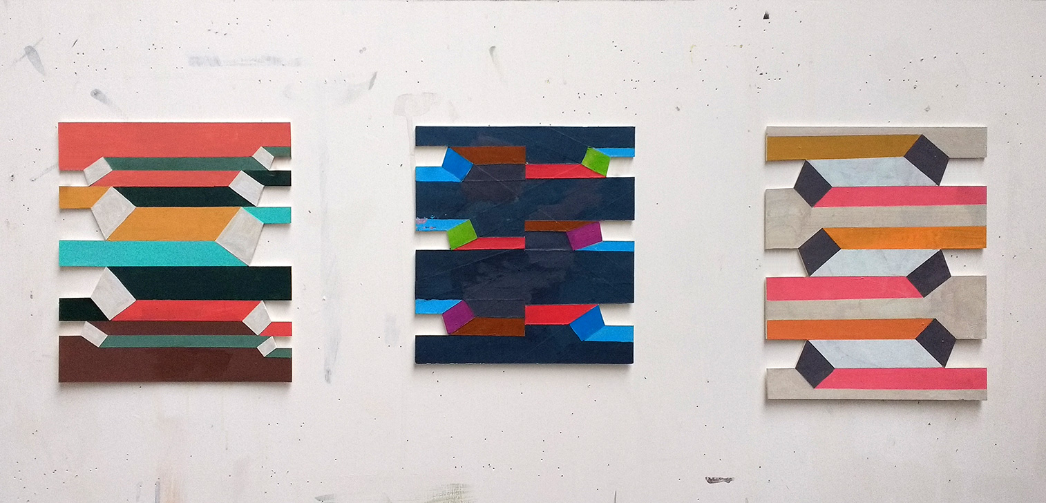 Studio wall with three tab/stripe paintings